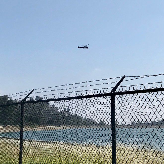Helicopter hovering over Silver Lake Reservoir